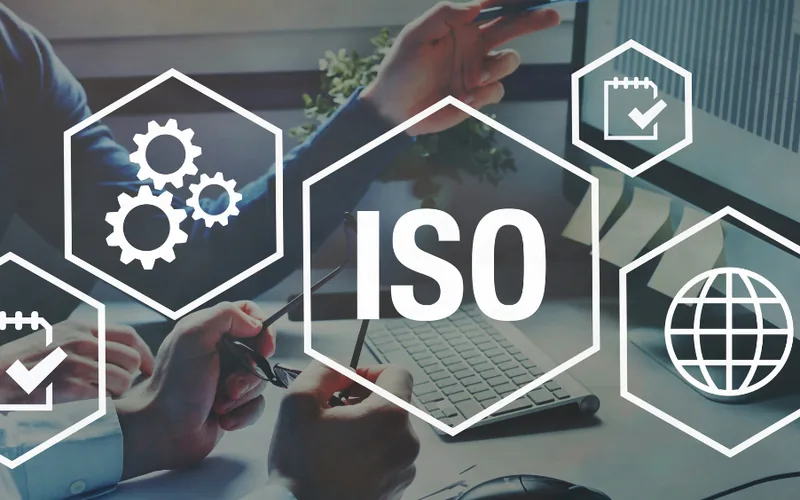 ISO standards icons over a work desk